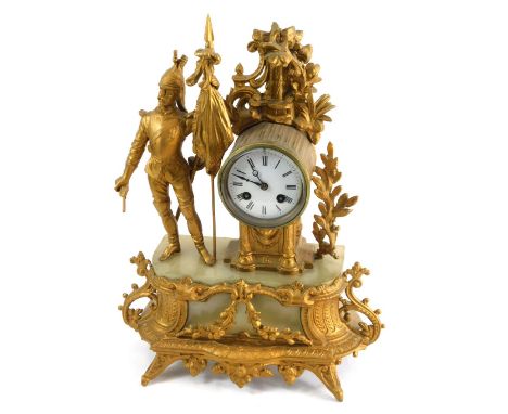 A 19thC gilt metal mantel clock, with figure of soldier aside 8cm diameter Roman numeric dial with eight day movement, surmou
