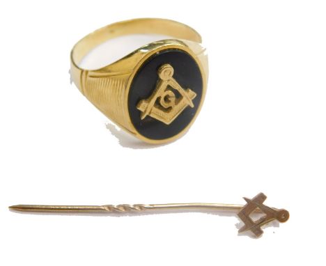 A part 18ct gold Masonic signet ring, the oval black stone set with set square initialled G, marked .750, size V, 5.7g all in