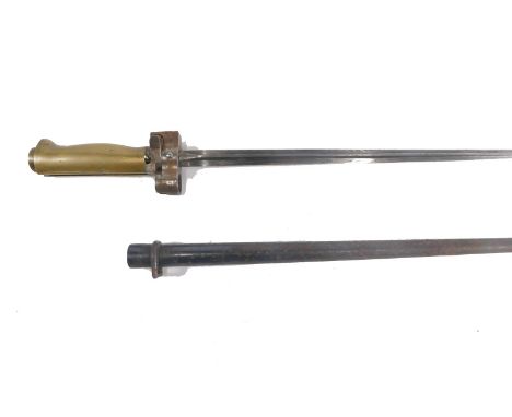 A 20thC cylindrical bayonet and scabbard, with unmarked shaped blade and brass handle, with compressed circular pommel, 64cm 