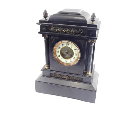 A 19thC black slate mantel clock, the 11cm diameter Arabic dial within an eight day movement, in a classical case flanked by 