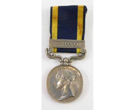 A medal, marked Army Of The Punjab, the ribbon with Goojerat clasp.  