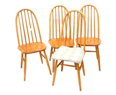 A set of four light Ercol stick back hoop back dining chairs, with H stretchers, some with associated cushions, 100cm high. (