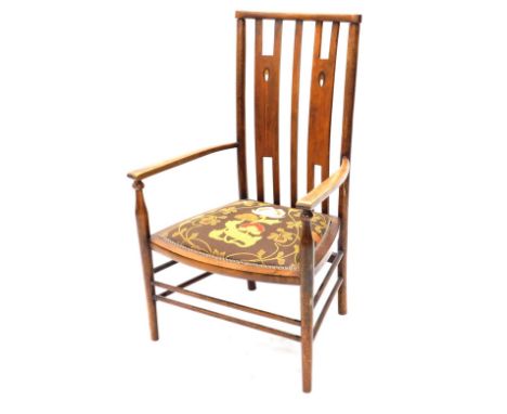 An Arts and Crafts Denby and Spinks of Leeds dining chair, with compressed comb top above inlaid H shaped splats, shaped arms