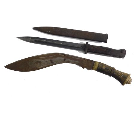 An early 20thC bayonet, the shaped blade marked 4568C S238G, the turned handle with metal pommel marked N1591P, with scabbard