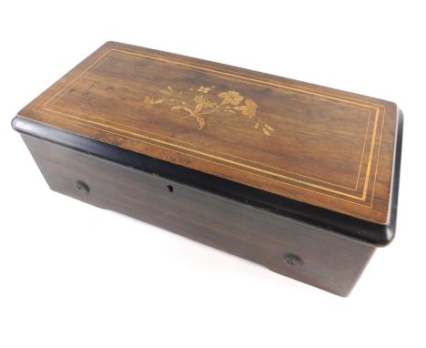 A 19thC rosewood and ebonised cylinder music box, with brass handle, silvered comb, with glazed lid and florally inlaid case 