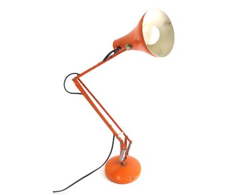 A 20thC painted metal Anglepoise lamp, with cone shaped shade, 27cm long, and articulated stem on circular foot, in orange. W