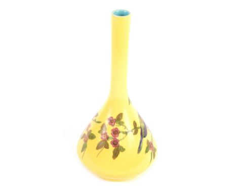 A 20thC Bretby stem vase, with cylindrical slender bottle and flask shaped body, decorated with bird on flowering branch, on 