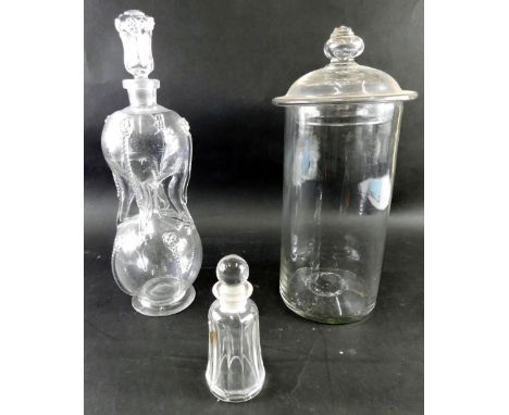 An early 20thC cut glass inverted decanter, with shaped stopper, double gourd shaped body and circular foot, 33cm high, a lid