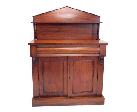 A Victorian mahogany chiffonier, with fixed top above open shelf, on turned supports, the subsection with cushion drawer abov