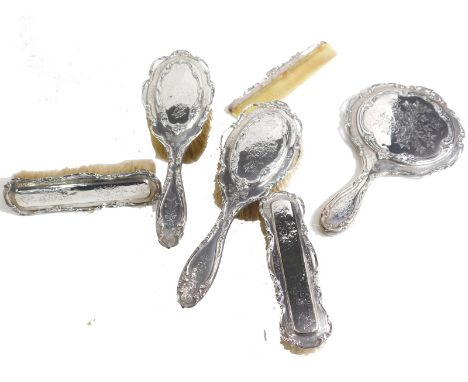 An Edward VII silver backed Harlequin dressing table set, by Henry Matthews, etc., comprising hand mirror, 25cm high, two clo