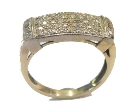 A 9ct gold dress ring, pave set with a panel of tiny diamonds totalling twenty four, with a rectangular central panel and two