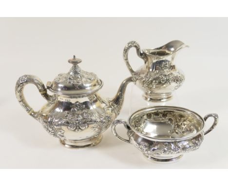 Edwardian silver three piece tea service, maker G M Co., Birmingham 1909, comprising lidded teapot, milk jug and sucrier, eac