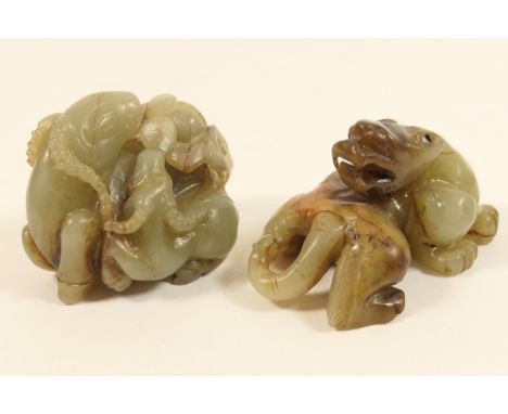 Chinese carved celadon jade formed as a mother sheep and her lamb eating funghi, 5cm; also a further Chinese celadon jade fig