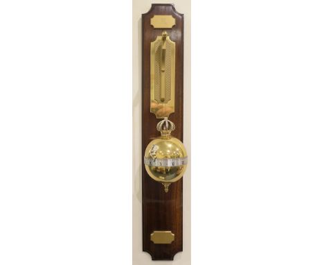 Dent & Co., London limited edition brass rolling and falling ball clock, the movement encased within a gilt brass orb, with s