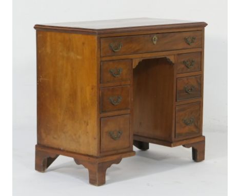 Mahogany kneehole dressing table, 18th Century with later restorations, fitted with a single long drawer over three small gra