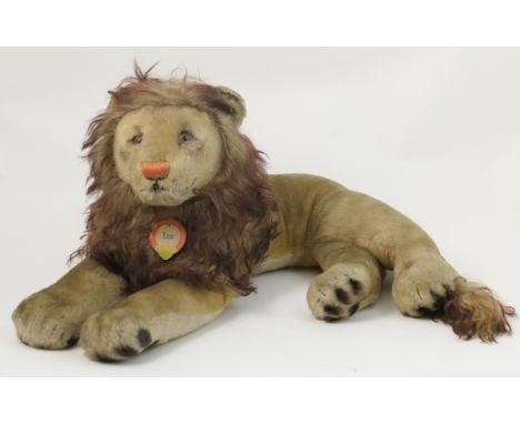 Steiff recumbent lion 'Leo', original paper collar label, length 66cm