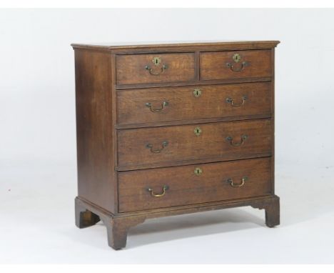 Early 19th Century oak chest of drawers, circa 1820-40, fitted with two short and three long drawers, each with brass swan ne