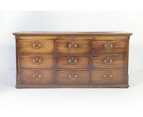George III mahogany Lancashire mule chest, having a lift up top over three false drawers and a further six real drawers, each