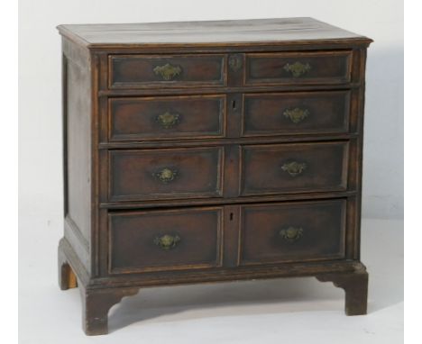 Oak joined chest of drawers, late 17th Century with later alterations, fitted with four long graduated moulded panel drawers 