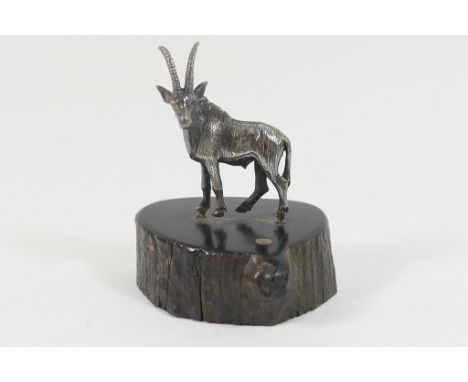 Patrick Mavros (Zimbabwe), Sterling silver miniature model of an Oryx, mounted on an ebony stand, height 5cm