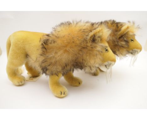 Pair of modern Steiff lions 'Lowe', with original paper collar labels, 40cm