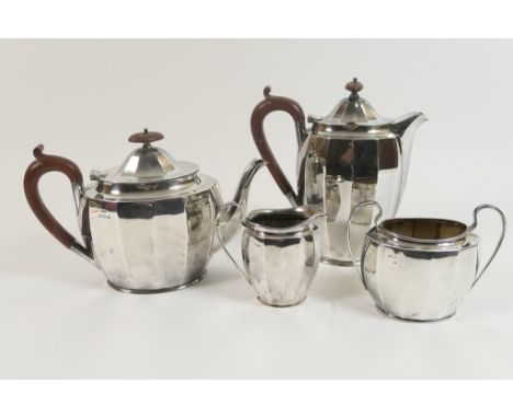 George V silver four piece tea service by Hukin & Heath, Birmingham 1928, plain faceted oval form, comprising lidded teapot, 