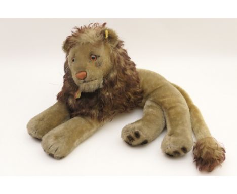 Vintage Steiff recumbent lion 'Leo', original paper collar label (ear button deficient), 35cm