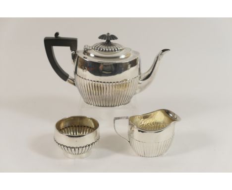 Victorian silver bachelor's teapot, London 1885, half reeded oval form with ebony finial and handle, height 12cm; also a matc