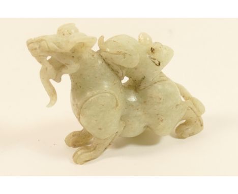Chinese carved pale celadon jade figure of a Kylin, with a rodent on his back, 8cm