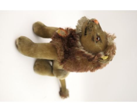 Steiff lion 'Rex', seated on haunches, original collar label, height 23cm