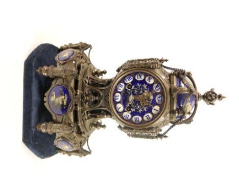 French cast metal and porcelain mantel clock in the Medieval Limoges style, the cast case surmounted with a cobalt blue porce