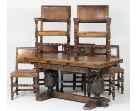 Reproduction oak refectory style dining table and eight leather upholstered dining chairs, the table in Elizabethan style wit