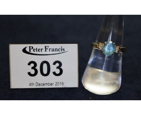 14t gold blue topaz and diamond ring, 2.9g approx. (B.P. 24% incl. VAT) CONDITION REPORT: Wear to surface. Tiny edge chips.