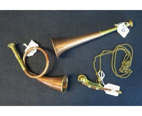 Miniature copper and brass post horn, bugle and brass and copper whistle on chain. (3)(B.P. 24% incl. VAT) CONDITION REPORT: 