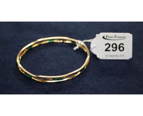 A 9ct gold open work bangle with green beads. 10g approx. (B.P. 24% incl. VAT)