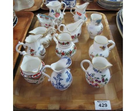 Tray of 12 Royal Worcester porcelain miniature jugs, varying designs, cream jugs etc., to include: Chinese ewer; ring neck ju