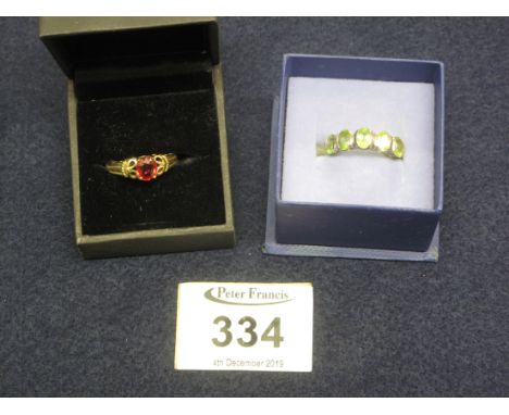 9ct gold and ruby ring, 3g approx, together with a silver and peridot ring. (B.P. 24% incl. VAT)