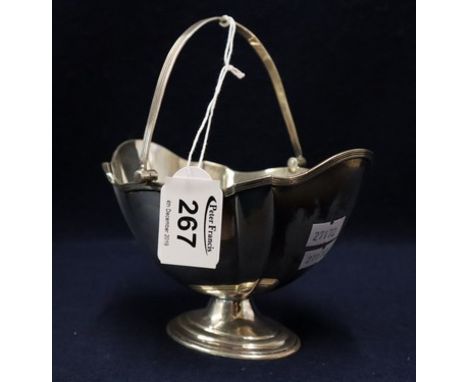 Silver boat shaped pedestal sucrier with reeded swing handle. Sheffield hallmarks, 6 troy ozs approx. (B.P. 24% incl. VAT)