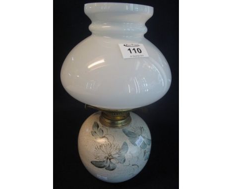 Brass double burner oil lamp with painted ceramic base and white glass shade. (B.P. 24% incl. VAT)
