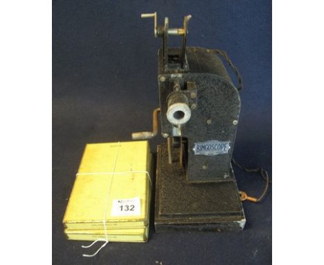 A 'Bingoscope Ideal Home Cinema' hand operated film projector with films.(B.P. 24% incl. VAT)  CONDITION REPORT: Seems to mec