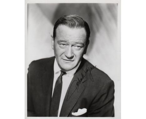  WAYNE JOHN: (1907-1979) American Actor, Academy Award winner. Signed 8 x 10 photograph, the image depicting Wayne in a head 