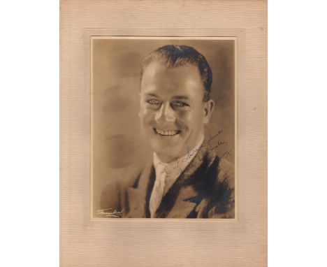  DENNY REGINALD: (1891-1967) English Actor. Vintage signed and inscribed sepia 8 x 10 photograph of Denny in a head and shoul