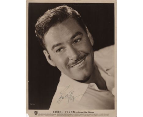  FLYNN ERROL: (1909-1959) Australian Film Actor. Vintage signed sepia 8 x 10 photograph, the image depicting Flynn in a head 