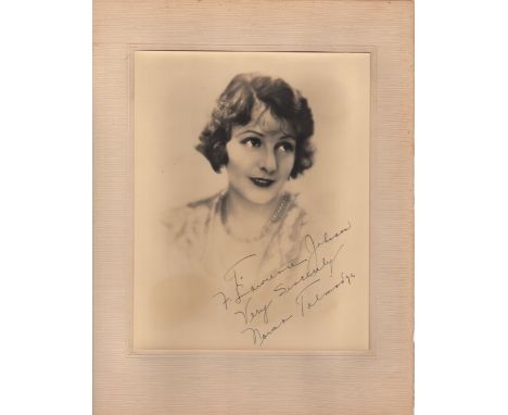  TALMADGE NORMA: (1894-1957) American Actress. Vintage signed and inscribed sepia 8 x 10 photograph of the actress in a head 