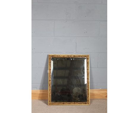 19th century bevelled wall mirror, the gilt frame with foliate and scroll decoration, 57.5cm x 70cm