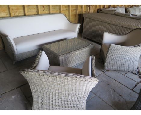 A Bramblecrest Monte Carlo three seater sofa, two armchairs and a coffee table with a side post parasol, designed to leave ou