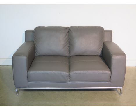 A new Furniture Village faux grey leather and chrome two seater linea sofa - 80cm H x 155cm W x 91cm D