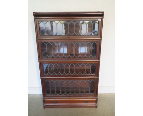 A four section Globe Wernicke bookcase with drawer to base, Globe Wernicke stamp to back of one section, approx 147cm H x 86.