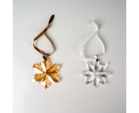 Lead clear and golden shadow colored crystals part of the Christmas Ornaments collection. They hang on a light brown ad white