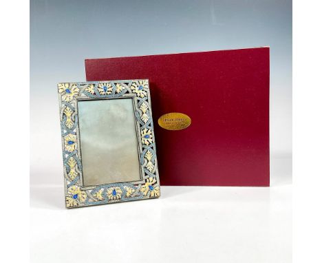 A stunning burnished silver plated 2-way picture frame. Decorated pearl glaze enameled leaves, and sapphire and clear diamond